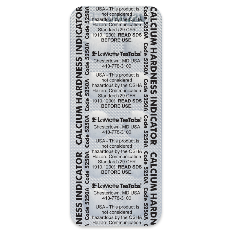 A blister pack labeled Calcium Hardness Indicator with repeated text including product details, hazard communication standards, a code number, and contact information for LaMotte TesTabs in Chestertown, MD.