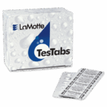 A box labeled LaMotte TesTabs Chlorine DPD #3 RAPID with a blue water drop design is shown next to two blister packs containing round tablets. The packaging features a subtle water droplet pattern in the background.
